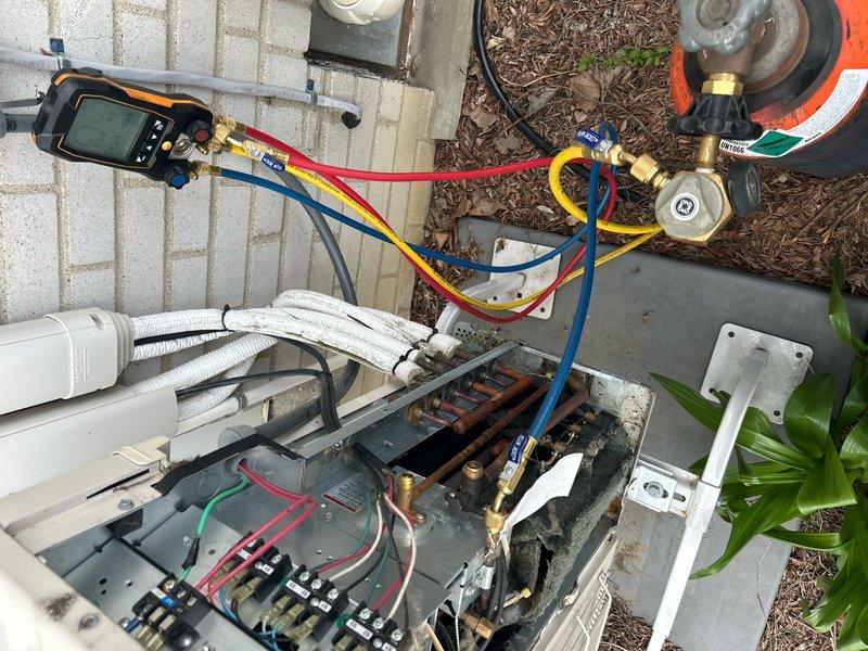 Performed nitrogen leak test on mini split system under full warranty coverage. System passed pressure test with no leaks detected. Added refrigerant charge to manufacturer specifications and verified proper operation of all components.