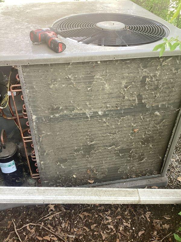 Completed scheduled Air Care Maintenance on residential cooling system. Replaced air filters and evaporative cooler pads as specified. Inspected outdoor condenser unit, which exhibited heavy accumulation of dirt, debris, and biological growth on coil fins requiring attention. Documented unit condition showing significant deterioration of condenser coil with clogged fins severely restricting airflow. Verified refrigerant lines and electrical connections. Unit operational upon service completion.
