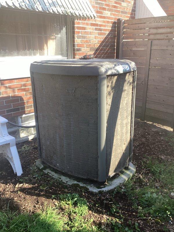 Completed scheduled Air Care Maintenance on residential cooling system. Replaced air filters and evaporative cooler pads as specified. Inspected outdoor condenser unit, which exhibited heavy accumulation of dirt, debris, and biological growth on coil fins requiring attention. Documented unit condition showing significant deterioration of condenser coil with clogged fins severely restricting airflow. Verified refrigerant lines and electrical connections. Unit operational upon service completion.