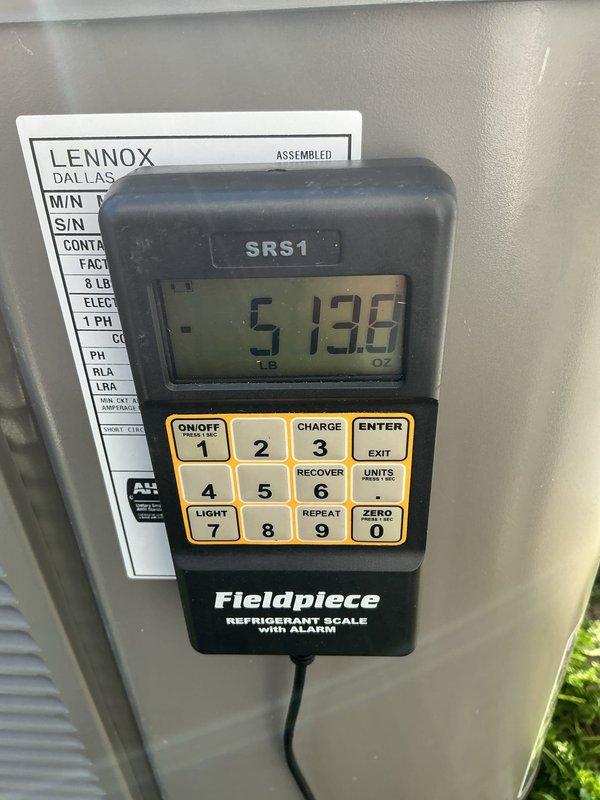 Responded to service call for 1-year-old Lennox central air conditioning unit experiencing short cycling issues. Upon arrival, system was operational but cycling on and off intermittently. Performed diagnostic testing using digital instruments to assess refrigerant levels and system pressures. Utilized Fieldpiece SRS1 refrigerant scale to verify proper refrigerant charge in the system. Measurements indicated refrigerant levels were within acceptable parameters. Conducted additional temperature and pressure readings to identify cause of short cycling behavior. System was evaluated for proper operation and cycling patterns were monitored to ensure stable performance before departure.