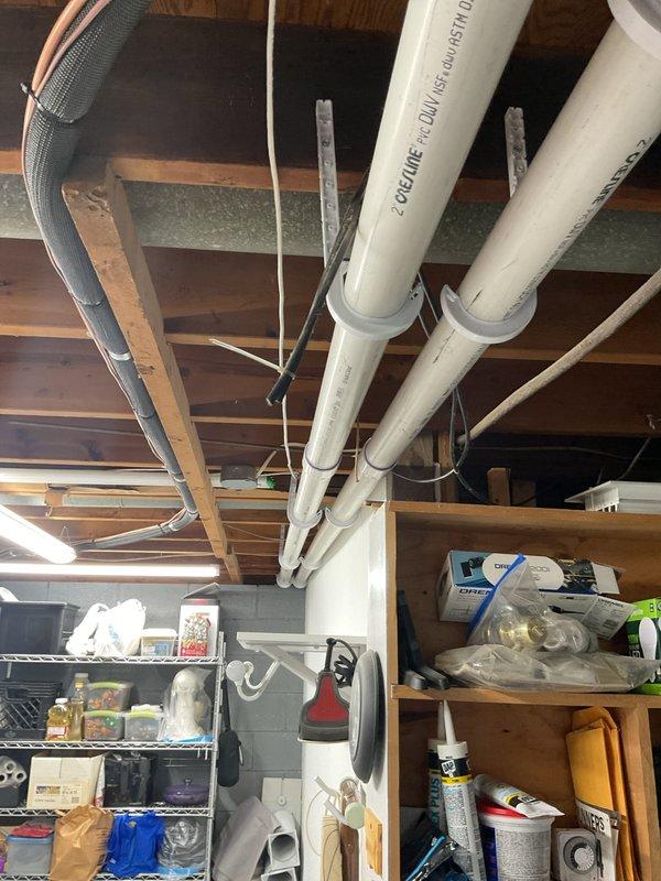 Completed full HVAC system installation including a 70,000 BTU furnace and 2-ton air conditioning unit in basement utility area. Installed new electrical circuit to support equipment, ran condensate drain lines with white PVC piping, and connected insulated ductwork throughout the system. Positioned furnace on protective pad adjacent to existing water heater with proper clearances for maintenance access. Secured all ductwork to ceiling joists with appropriate hangers, completed electrical connections, and verified all mechanical and electrical components operational. Obtained necessary mechanical and electrical permits prior to installation. All equipment tested and functioning within manufacturer specifications upon completion.