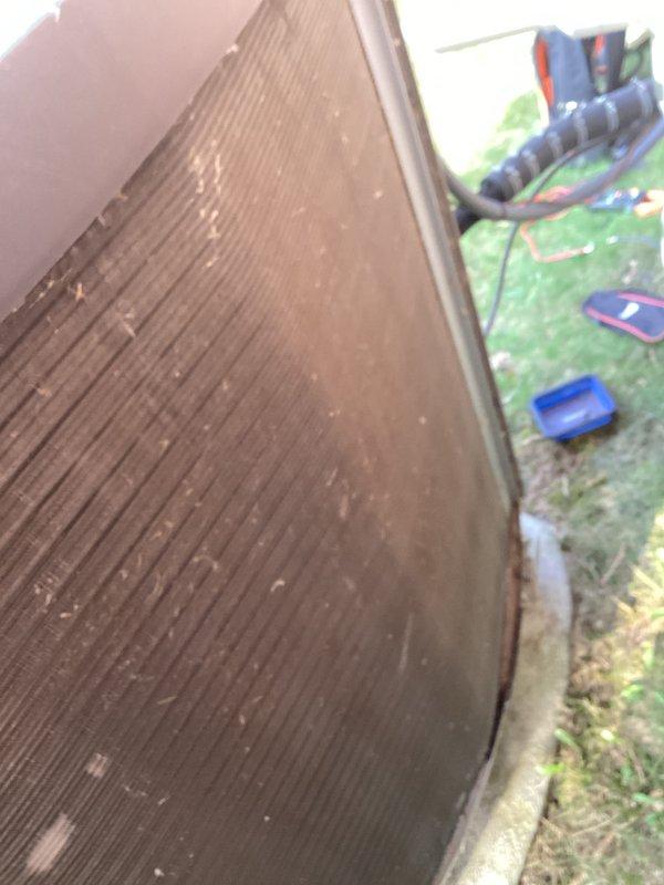 Completed annual cooling maintenance on two residential air conditioning units. Inspected both outdoor condensers, noting significant dust and debris accumulation on coil fins requiring cleaning. Both units showed typical wear from outdoor exposure with surface dirt, weathering on mounting pads, and algae growth on concrete bases. Performed standard ACM protocol including visual inspection of casings, coil condition assessment, and documentation of equipment status through photographs.