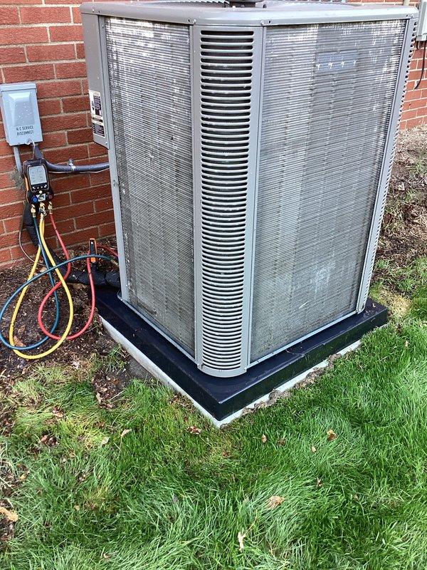 Completed annual preventive maintenance on residential air conditioning system. Connected manifold gauge set to measure refrigerant pressures and verify system performance. Unit operational with no immediate issues identified during inspection.