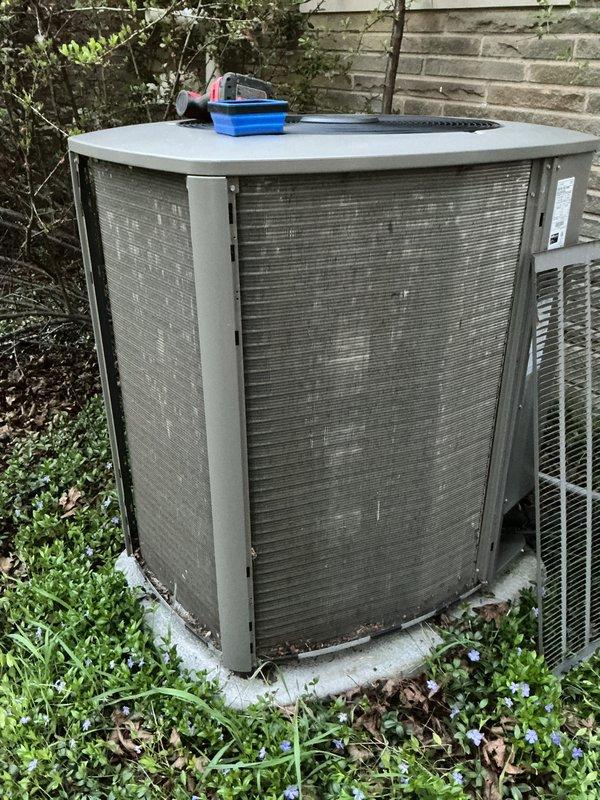 Completed scheduled seasonal air conditioner tune-up and maintenance service on residential outdoor condensing unit. System was operational upon arrival and confirmed to be working properly. Performed comprehensive inspection of condenser unit exterior, verified proper airflow through mesh grille panels, and checked overall unit condition. Utilized Fieldpiece SMAN refrigerant manifold and vacuum gauge to measure and document system pressures and refrigerant levels. All diagnostic readings were within normal operating parameters. System left in proper working condition with no issues identified requiring immediate attention.