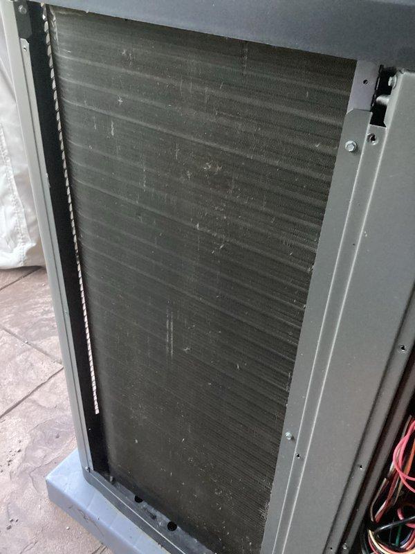 Completed annual cooling maintenance on HVAC system. Inspected evaporator coil and noted significant dust and debris accumulation on fin surfaces requiring attention. Replaced air filters and evaporative cooling pads as needed to restore proper airflow and system efficiency.