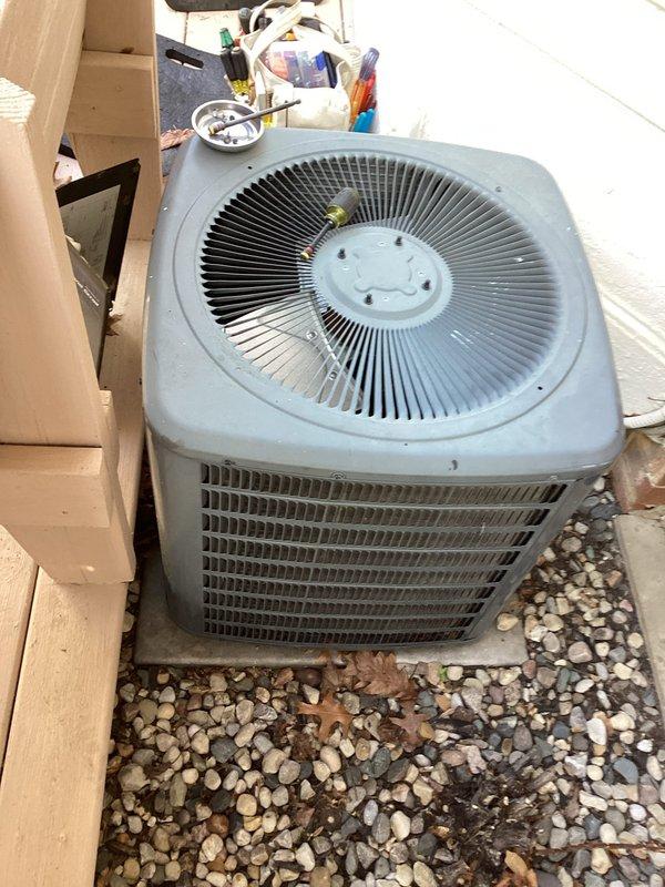 Responded to cooling complaint where system would not maintain temperature below 77 degrees. Performed complete annual cooling maintenance (ACM) on outdoor condenser unit, including inspection of fan motor assembly, cleaning of condenser coils, verification of refrigerant charge using manifold gauges, and testing of electrical components. Unit operational and cooling properly upon completion of maintenance and diagnostics.