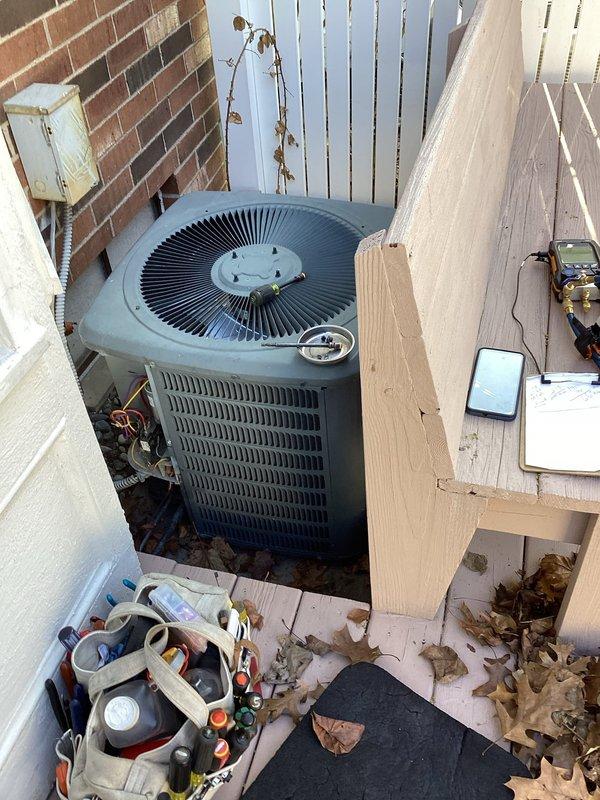 Responded to cooling complaint where system would not maintain temperature below 77 degrees. Performed complete annual cooling maintenance (ACM) on outdoor condenser unit, including inspection of fan motor assembly, cleaning of condenser coils, verification of refrigerant charge using manifold gauges, and testing of electrical components. Unit operational and cooling properly upon completion of maintenance and diagnostics.