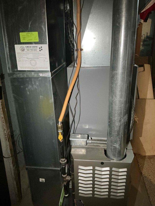 Conducted on-site evaluation of 20-year-old air conditioning system with suspected refrigerant leak. Assessed existing HVAC equipment including furnace, air handler, and ductwork configuration in basement installation to provide comprehensive replacement quote for complete system upgrade due to age and operational concerns.