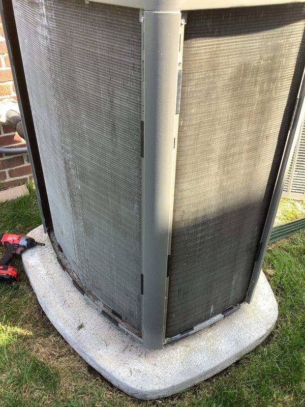 Completed comprehensive 5-year ComfortGuard Maintenance visit on residential outdoor condensing unit. Performed standard maintenance protocol including inspection of cabinet, heat exchanger fins, and fan assembly. Addressed specialty service need by removing deteriorated caulking around refrigerant line penetration point and resealing piping entry from outdoor unit to interior with fresh weatherproof caulk to restore moisture barrier and prevent air infiltration. Unit operational and returned to service.
