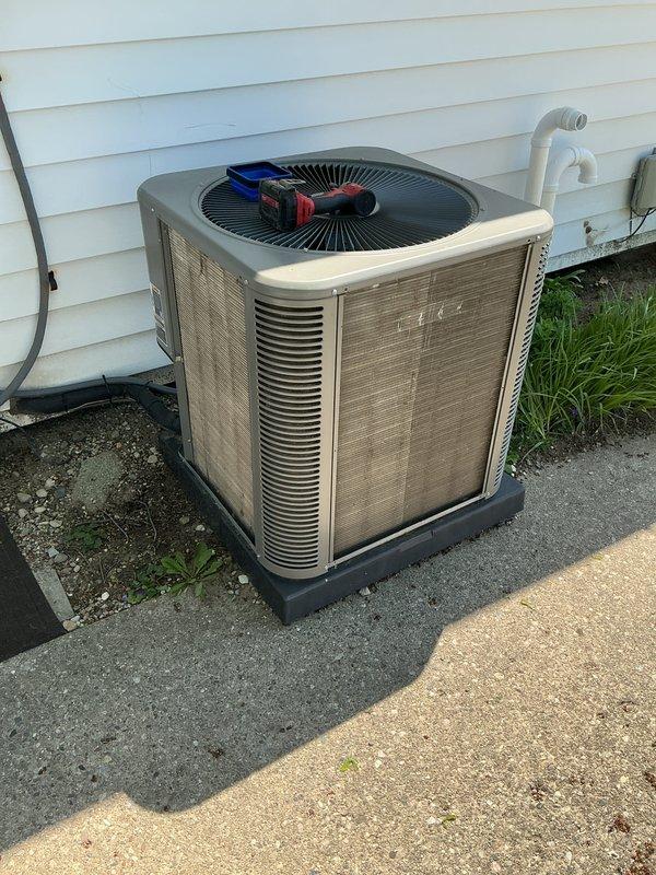 Completed comprehensive air conditioning maintenance inspection on residential condensing unit. Performed system diagnostics using digital manifold gauges, recording operating pressures, superheat, and subcooling values to verify proper refrigerant charge and system performance. Unit operating within normal parameters with no deficiencies noted during inspection.