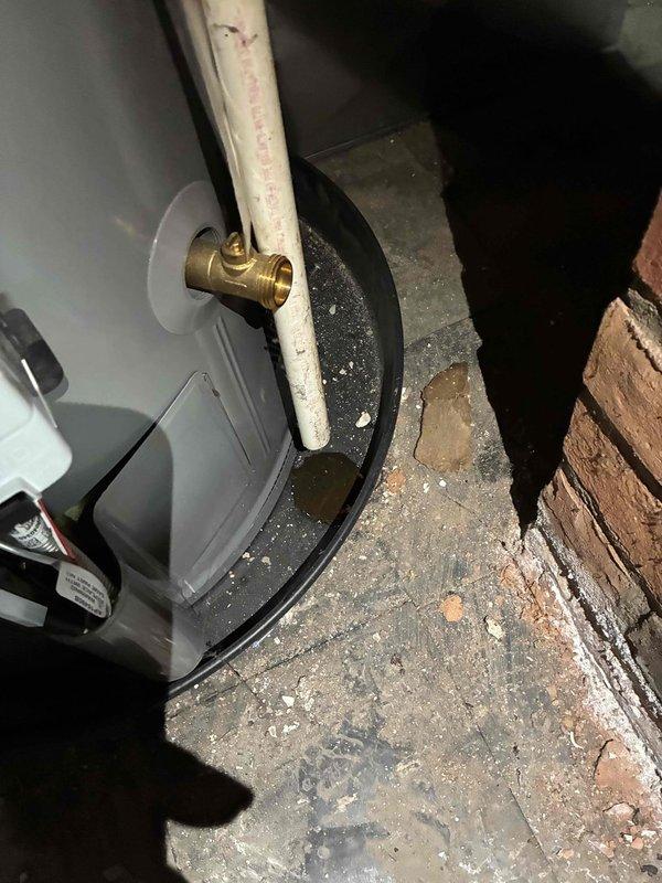 Completed comprehensive whole home plumbing inspection with focus on water heater system in 1957-built residence. Thoroughly examined water heater unit, including all connections, T&P relief valve, combustion chamber access, venting system, and surrounding infrastructure. Inspected PVC venting configuration, brass fittings, and condensate pump operation. Evaluated basement plumbing infrastructure, including visible supply and drain lines, floor conditions for signs of water damage or leaks, and concrete block foundation walls for moisture intrusion. Documented water heater manufacturer labels, safety warnings, and installation specifications. Verified proper clearances around unit and assessed overall condition of aging mechanical systems. No deficiencies, leaks, or safety concerns identified during inspection. All components functioning within normal parameters. Photographic documentation captured for maintenance records.