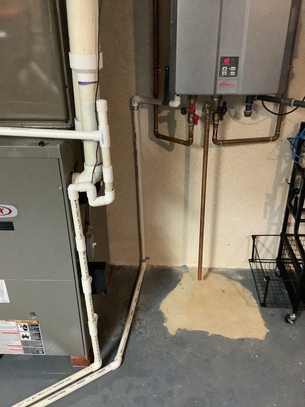 Responded to service call for 18-year-old Lennox furnace leaking water in basement during air conditioning operation. Upon inspection, identified condensate drainage issue causing water accumulation on concrete floor beneath HVAC equipment. Performed diagnostic evaluation of condensate drain lines, cleared blockage in PVC drainage system, and verified proper flow from air handler to drain.