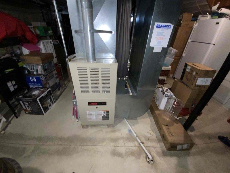 Provided estimate for replacement of 17-year-old natural gas furnace located in basement and 26-year-old air conditioning unit located outside. Current furnace operational but air conditioning unit not working. Assessed existing Lennox furnace installation with metal ductwork system and evaluated replacement options for complete HVAC system upgrade.