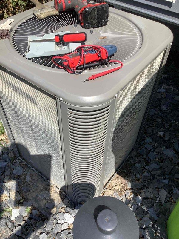 Completed comprehensive annual air conditioning maintenance on residential condensing unit. Performed complete system tune-up including inspection of all electrical components, testing of capacitor and contactor operation, verification of proper refrigerant pressures, cleaning of condenser coils, and lubrication of fan motor. All components found to be operating within manufacturer specifications. System tested and confirmed cooling properly with no deficiencies noted.