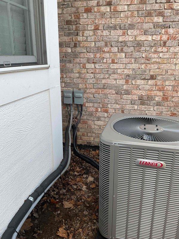 Completed full HVAC system installation including a 90,000 BTU high-efficiency furnace with humidifier and 3-ton air conditioning unit with rear discharge configuration. Installed Lennox condenser unit on exterior pad with proper electrical disconnect, refrigerant lines, and condensate drainage. Configured indoor furnace system in basement utility area with PVC venting, copper refrigerant tubing, and integrated humidification system. All mechanical permits obtained and equipment reconnected to existing ductwork and utilities per code requirements.