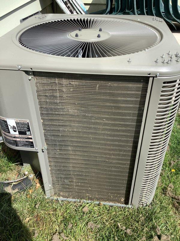 Completed routine preventative maintenance on outdoor air conditioning condenser unit as part of recurring Air Care Cooling service. Inspected condenser coil which showed normal accumulation of dirt and debris on fins, verified unit operation, and recorded ambient temperature reading of 77.8°F. All components functioning within normal parameters.