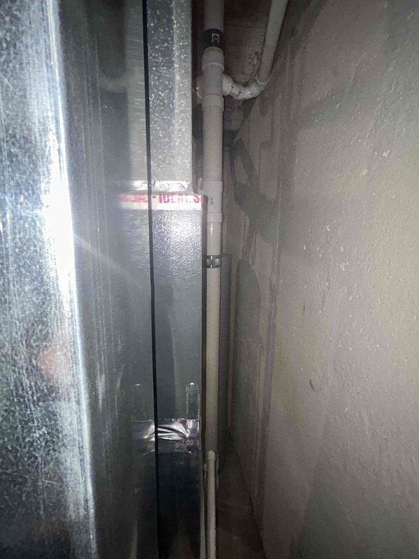 Conducted replacement estimate for 16-year-old residential air conditioning system experiencing chronic refrigerant loss. Assessed existing outdoor condenser unit and indoor components, documented current installation configuration including PVC condensate drainage and electrical disconnect. Provided customer with equipment replacement options and recommendations due to ongoing refrigerant leak issues making repair cost-prohibitive for aging system.