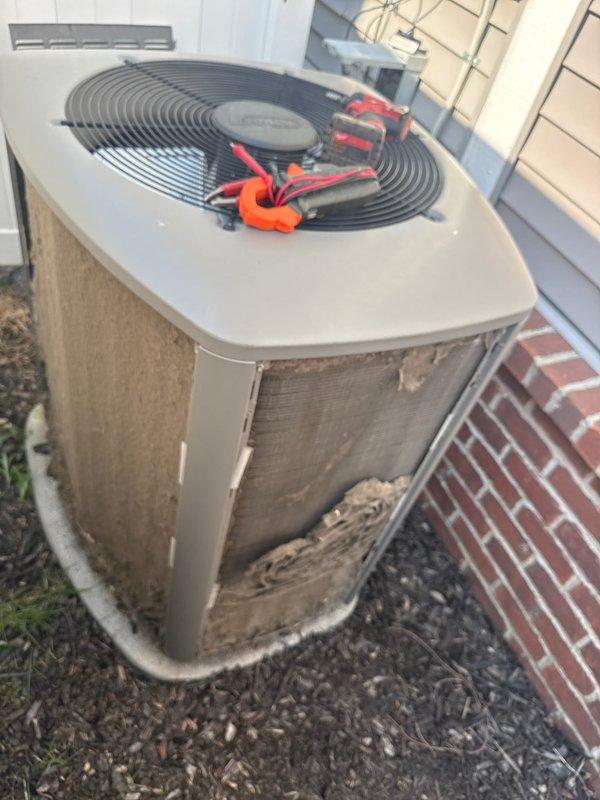 Completed routine AC tune-up on 5-year-old residential air conditioning system. Performed comprehensive maintenance including electrical testing with multimeter, inspected condenser unit exterior condition, verified fan operation and protective grille integrity, and assessed refrigerant lines and condensate drainage. System operating within normal parameters with no deficiencies identified requiring immediate attention.