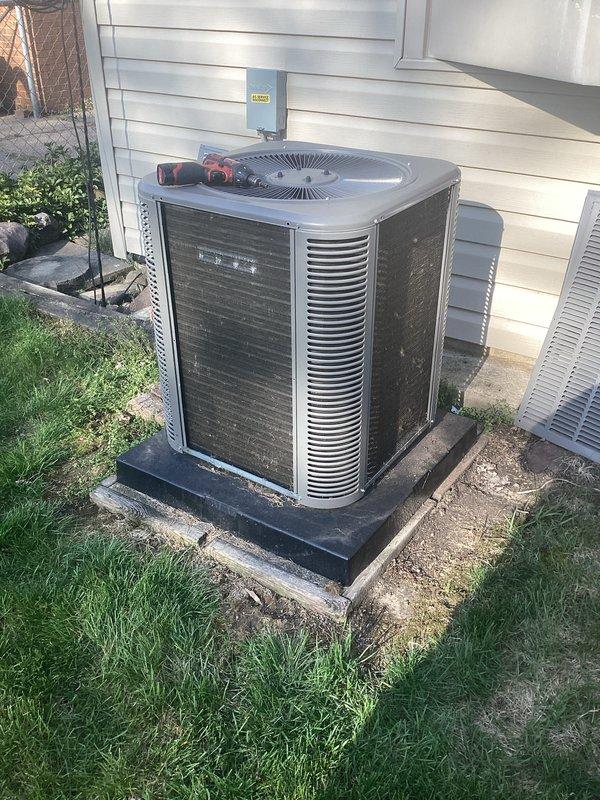 Completed annual HVAC maintenance on residential air conditioning system. Performed comprehensive inspection of outdoor condenser unit, removed access panel to evaluate internal coil condition, checked electrical connections, and verified proper operation of all components. Unit found in satisfactory working condition with normal wear consistent with outdoor exposure.