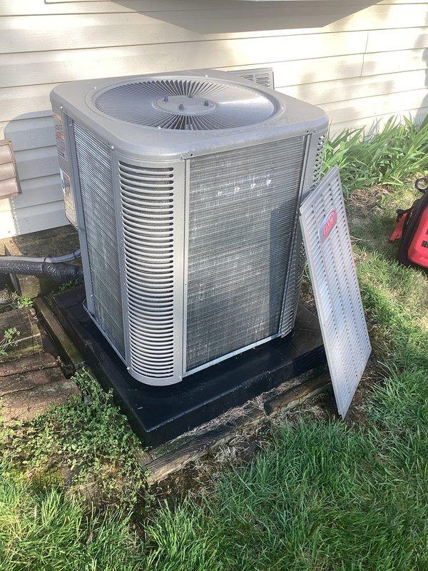 Completed annual HVAC maintenance on residential air conditioning system. Performed comprehensive inspection of outdoor condenser unit, removed access panel to evaluate internal coil condition, checked electrical connections, and verified proper operation of all components. Unit found in satisfactory working condition with normal wear consistent with outdoor exposure.