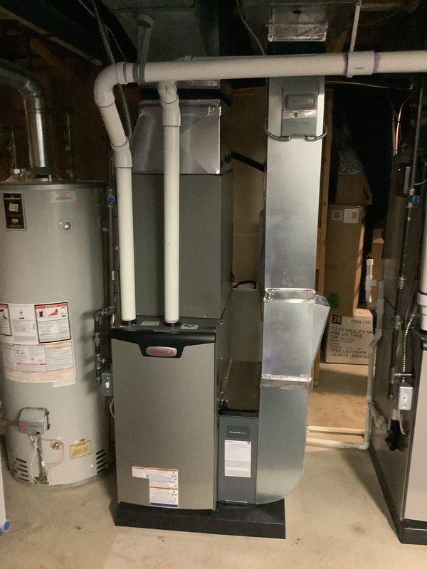Completed full dual-system HVAC installation in residential basement, installing two complete furnace and air conditioning systems. First system consisted of a 70,000 BTU furnace paired with a 3-ton air conditioning unit, while second system featured a 90,000 BTU furnace with an additional 3-ton AC unit for rear zone coverage. All mechanical permits obtained and approved prior to installation. Successfully installed both furnace units with proper PVC venting systems, connected refrigerant lines, installed ductwork connections, and established all electrical connections. Reconnected existing components as needed and verified proper operation of both complete systems. Installation completed with all equipment properly labeled, vented, and positioned for optimal performance and serviceability in basement mechanical room.