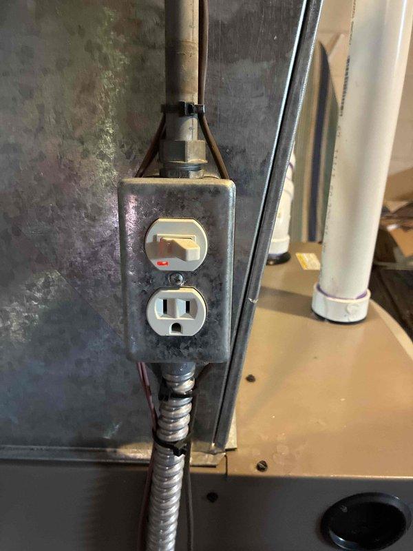 Replaced a 1-inch threaded gate valve at the water service line to facilitate water meter servicing by the municipal water department. The existing valve was removed and a new gate valve was installed using threaded connections on the galvanized piping assembly located near the water meter at floor level.