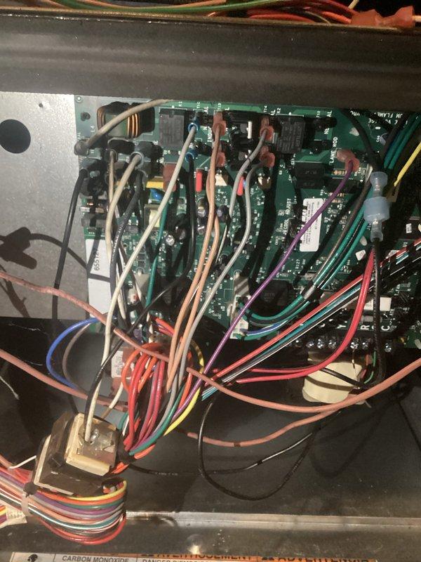 Responded to no heat call on furnace system. Upon arrival, determined that an electrical arcing event occurred in the home's grounding system during plumbing work near the water main, which caused the furnace control board to shut down and become non-operational. Performed diagnostic inspection of the furnace control board and electrical components, documenting the condition of the circuit board, relay modules, wiring connections, and transformer assembly. System remains non-operational pending further evaluation and potential control board replacement due to electrical damage from the grounding system arc.