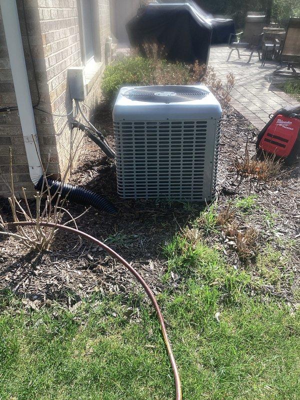 Completed annual cooling maintenance on residential air conditioning system. Performed system diagnostics with digital multimeter, recording operational parameters and verifying proper electrical values. Replaced air filter and cleared vegetation debris from around condenser unit to ensure adequate airflow and prevent obstruction of ventilation grilles.