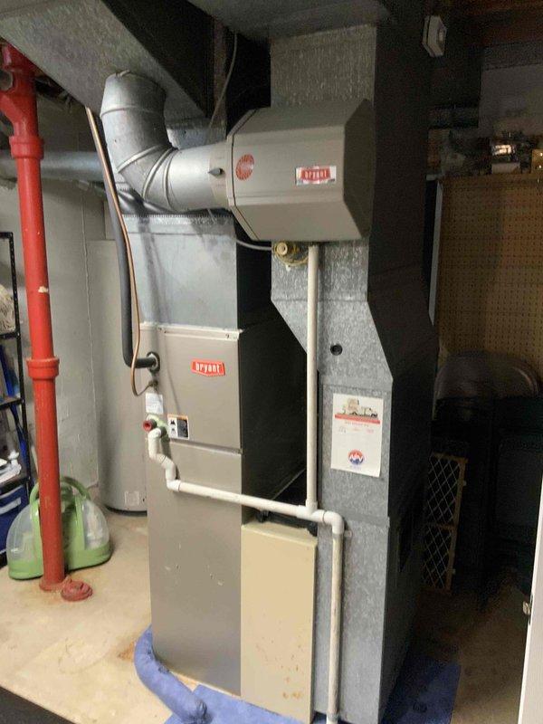 Completed estimate for air conditioning system replacement at residential property. Assessed existing AC unit located with furnace system in basement utility room. Current equipment operational but aged and due for replacement. Outdoor condenser unit inspection revealed heavily soiled coil fins with significant debris accumulation affecting efficiency. Indoor assessment documented Bryant furnace with proper ventilation connections and ductwork configuration. Provided comprehensive replacement quote for new AC system compatible with existing basement installation and ductwork infrastructure.
