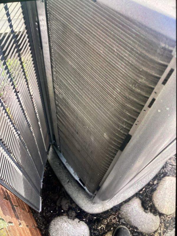 # HVAC Maintenance - ACM

Completed annual cooling maintenance on outdoor condenser unit. Performed comprehensive inspection of condenser coil assembly, which showed significant accumulation of dirt, dust, and debris between fins requiring attention. Coil fins were intact without bending or damage. Cleaned condenser coils to restore proper heat transfer efficiency and airflow. Replaced air filter and evaporator pad as scheduled maintenance items. Verified unit operation and proper drainage. All components functioning within normal parameters upon completion.