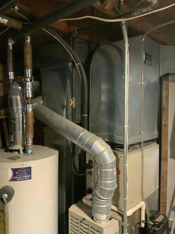 Provided comprehensive estimate for complete HVAC system replacement including furnace and air conditioning unit for 20-year-old non-operational equipment located in basement. Assessed existing beige furnace with metallic ductwork and outdoor AC unit positioned on concrete pad against house exterior, documented current system configuration including water heater proximity and duct routing through basement joists. Prepared detailed quote for furnace and air conditioning replacement under promotional offer, scheduled estimate consultation during afternoon appointment window.