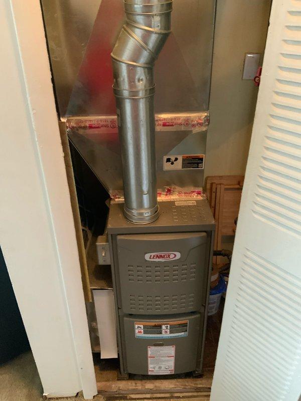 Provided estimate for new air conditioning system installation at residential property currently without existing A/C equipment. Assessed utility closet containing recently installed Lennox furnace with proper venting and reviewed available space for potential outdoor condenser unit placement. Documented existing HVAC infrastructure including furnace installation, water heater location, and utility closet configuration to determine compatibility and requirements for complete cooling system addition.