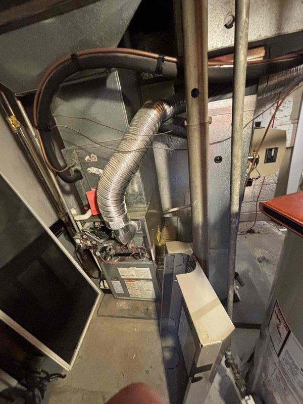 Evaluated 16-year-old Carrier HVAC system with R22 refrigerant leak in air conditioning unit. Determined that repair would provide only temporary relief and recommended full system replacement as most cost-effective solution. Documented existing equipment configuration including furnace, air handler, and refrigerant line routing in basement mechanical room. Provided comprehensive replacement estimate for complete HVAC system upgrade, noting customer is Air Care member and electrical panel upgrade was previously quoted.