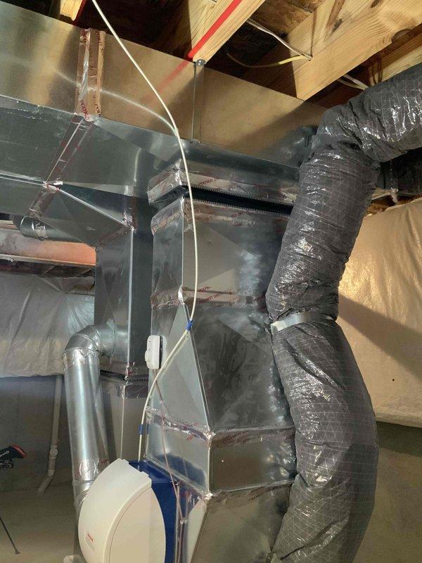 Conducted comprehensive site evaluation for full HVAC system replacement of 15-year-old existing equipment. Assessed current air handler installation in basement crawl space, including existing ductwork configuration with flexible and rigid metal supply lines, electrical connections, and clearance requirements. Evaluated outdoor condensing unit positioned under covered structure on gravel pad against brick exterior, noting proper drainage and ventilation access. Documented complete system specifications and installation conditions to provide detailed replacement estimate for upgraded heating and cooling equipment, addressing customer's request for timely system replacement within the next couple weeks.