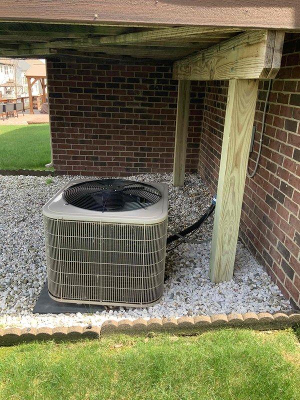 Conducted comprehensive site evaluation for full HVAC system replacement of 15-year-old existing equipment. Assessed current air handler installation in basement crawl space, including existing ductwork configuration with flexible and rigid metal supply lines, electrical connections, and clearance requirements. Evaluated outdoor condensing unit positioned under covered structure on gravel pad against brick exterior, noting proper drainage and ventilation access. Documented complete system specifications and installation conditions to provide detailed replacement estimate for upgraded heating and cooling equipment, addressing customer's request for timely system replacement within the next couple weeks.