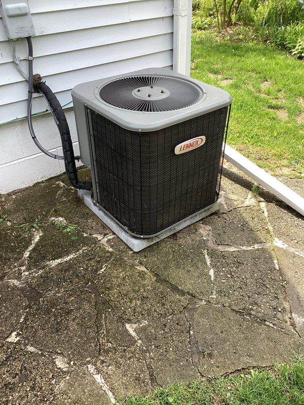 Completed annual cooling maintenance on Lennox condensing unit. Performed comprehensive system inspection including refrigerant line check, electrical connections, and condenser coil cleaning. Replaced air filter and evaporative cooler pad as requested. Unit operating within normal parameters with no immediate service needs identified. Noted concrete pad beneath unit shows significant cracking and deterioration but does not affect equipment operation at this time.