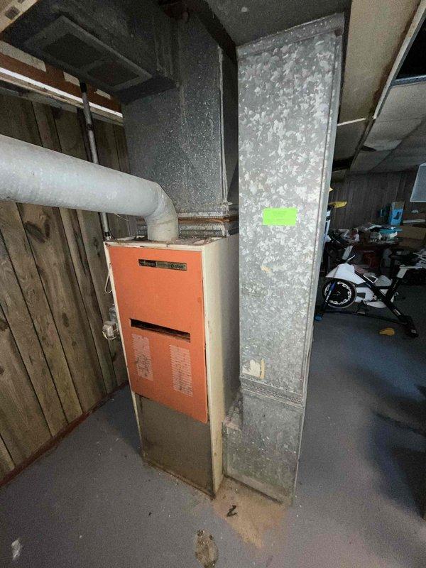 Provided estimate for furnace and air conditioning replacement in basement location. Current 15-year-old equipment is operational but nearing end of service life. Assessed existing heating system configuration including ductwork, venting, and clearances to determine replacement specifications and installation requirements.