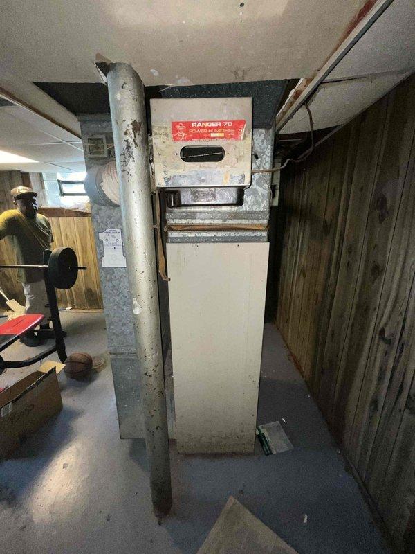 Provided estimate for furnace and air conditioning replacement in basement location. Current 15-year-old equipment is operational but nearing end of service life. Assessed existing heating system configuration including ductwork, venting, and clearances to determine replacement specifications and installation requirements.