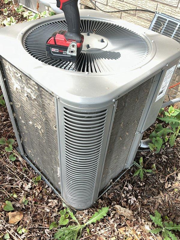 Completed annual cooling maintenance on residential air conditioning system. Performed system diagnostics using digital manifold gauge set, inspected condensing unit operation, and evaluated overall equipment condition. Unit exterior panels showed weathering and dirt accumulation; heat exchanger coils were accessible for inspection. Noted vegetation growth and debris around unit base that may restrict airflow if not maintained. System operational at time of service.