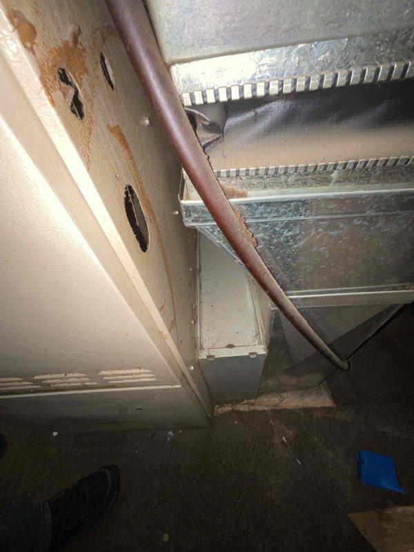 Provided comprehensive estimate for complete HVAC system replacement including both air conditioning and natural gas furnace under promotional offer. Evaluated 29-year-old existing equipment located in basement, with furnace currently non-operational while air conditioning unit still functioning. Documented existing beige cabinet-style furnace with connected ductwork and assessed installation conditions including concrete floor workspace, exposed ceiling joists, and existing ventilation infrastructure for replacement planning.