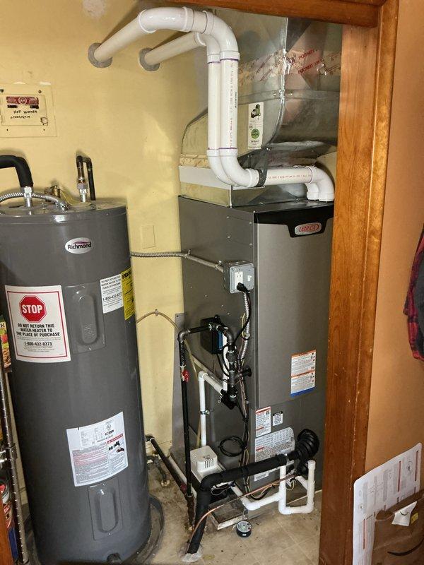 Completed full HVAC system installation including a Lennox EL297DF070U48BB-02 downflow furnace rated at 70,000 BTU and a 2-ton air conditioning unit with rear discharge configuration. Obtained mechanical and electrical permits prior to installation. Installed furnace in utility closet with proper PVC exhaust and intake venting system, configured all electrical connections and controls, and installed condensate pump with drainage piping. Connected and commissioned outdoor AC condenser unit. Verified all safety controls, tested system operation, and confirmed proper airflow and temperature differential. Installation completed per manufacturer specifications and local code requirements, with financing documentation processed through Michigan Saves program and DTE rebate application submitted.