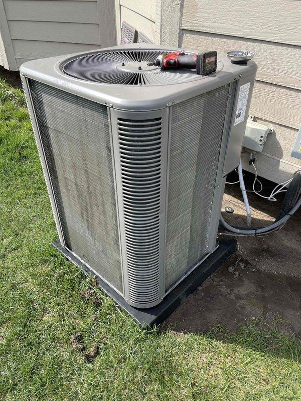Performed routine air conditioning maintenance on residential outdoor condensing unit. Conducted comprehensive system inspection including cleaning of condenser coils, checking electrical connections at disconnect box, verifying refrigerant line integrity, and testing fan operation. Unit serviced and returned to proper operating condition with all components functioning within manufacturer specifications.