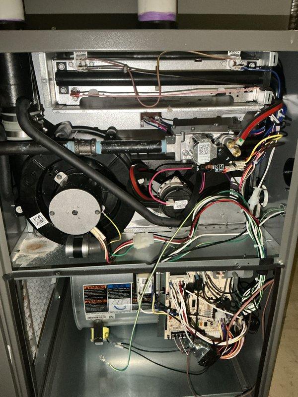 Completed annual HVAC maintenance inspection on residential furnace and air conditioning system. Removed access panels and performed comprehensive visual inspection of all internal components including heat exchanger, blower motor assembly, refrigerant lines, electrical connections, control board, and safety devices. All components found operating within normal parameters with no immediate service needs identified. Documented system condition with photographs for service records.