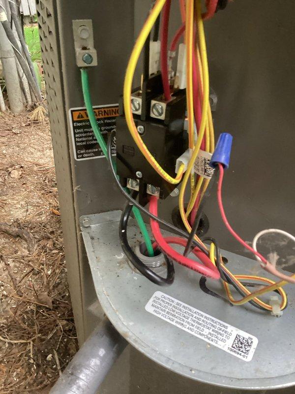 Responded to service call for air conditioning unit making unusual noises during startup cycle. Performed diagnostic inspection of 4-year-old outdoor condensing unit and electrical control panel. Inspected all electrical connections, wire terminations, and control components within the disconnect box and main unit housing. Verified proper wire routing, terminal connections, and wire nut assemblies throughout the electrical system. Examined contactor, capacitor, and control board wiring for signs of arcing, loose connections, or component failure that could cause audible disturbances during compressor startup. All electrical connections found secure and properly terminated. Unit tested through multiple startup cycles to identify source of reported noise.