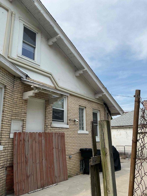 Completed full installation of Mitsubishi Electric mini-split system on residential property. Mounted outdoor condenser unit on exterior brick wall using secure metal bracket, ran refrigerant lines and electrical conduit along exterior wall with proper securing clips, and installed new dedicated electrical circuit per permit requirements. All mechanical and electrical permits obtained and work completed to code specifications.