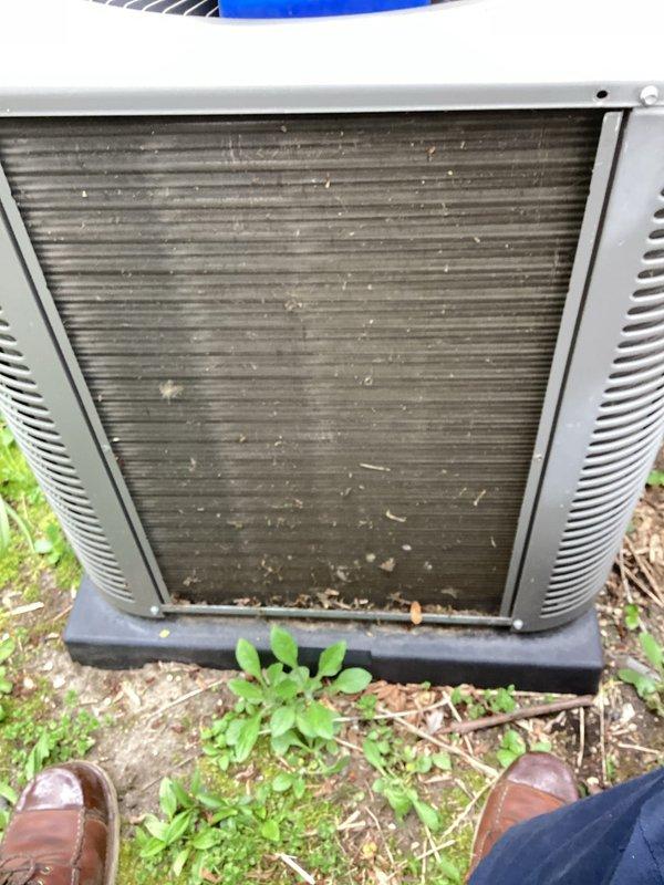 Performed routine maintenance on outdoor condensing unit as part of recurring cooling service. Condenser coils showed significant accumulation of dirt, debris, and organic matter between fins. Cleaned condenser coils using appropriate tools and techniques to restore proper airflow and heat transfer efficiency. Removed leaves, twigs, and other debris from coil surfaces and surrounding unit base. Unit operational upon completion of maintenance.