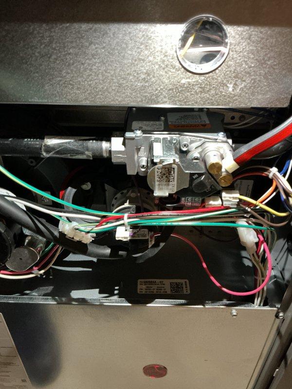Completed comprehensive Air Care Heating and Cooling maintenance service on residential HVAC system. Performed thorough inspection of indoor air handler components including gas valve assembly, electrical connections, and control modules, verifying all wiring harnesses and safety controls were properly secured and functioning. Inspected outdoor condensing unit, tested system performance with digital multimeter, and installed MERV 11 air filter to maintain optimal air quality and system efficiency.