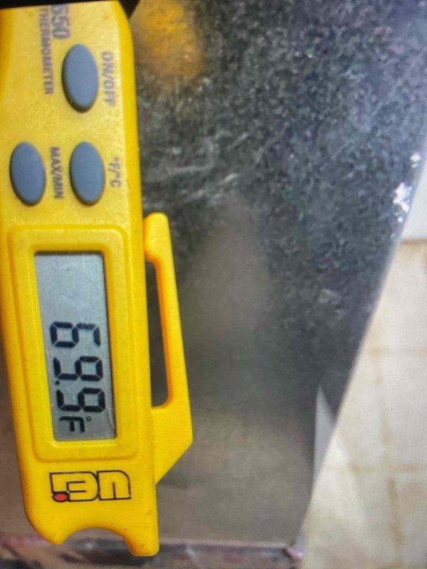 Performed system start-up on 6-month-old outdoor air conditioning unit following winter installation. Verified operational temperatures using digital thermometer, recording suction line temperature at 36°F and discharge measurements at 50°F. Inspected electrical components including capacitors and confirmed all connections secure. System operating within manufacturer specifications with both parts and labor under warranty coverage.