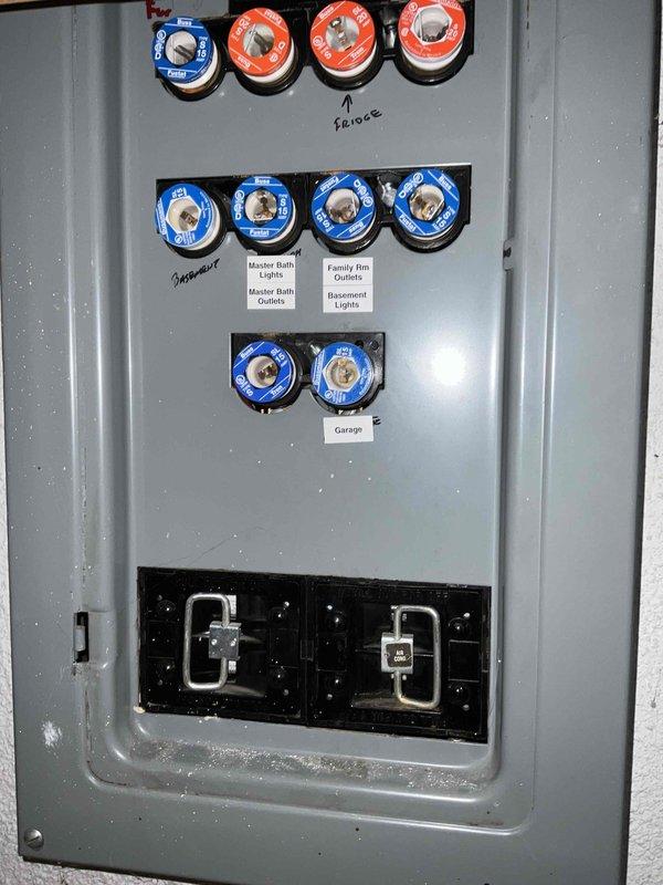 Provided estimate for complete furnace and air conditioning system replacement in basement location. Existing 1987 heating system is non-operational and has exceeded its serviceable lifespan. Assessed current installation including ductwork configuration, electrical service capacity at main panel, and available clearances in utility room shared with water heater and storage. Documented existing equipment layout and electrical infrastructure to determine proper sizing and installation requirements for new HVAC system.