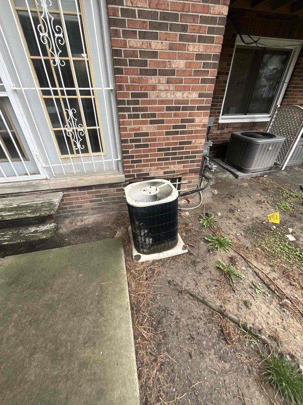 Provided estimate for complete HVAC system replacement in a mother-daughter home with a 30-year-old non-functional air conditioning unit and natural gas furnace located in the basement. Assessed existing vertical furnace/air handler with gray sheet metal ductwork and aged exterior condenser unit with cylindrical coil on concrete pad. Recommended full system replacement due to equipment age and current system failure.